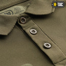 Close-up of olive green M-TAC military style breathable tactical polo shirt with buttons and textured fabric