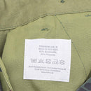 Clothing label inside Mil-Tec German army style Flecktarn cargo field pants showing material and care instructions.