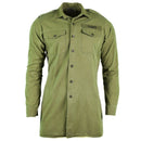 Long sleeve olive green British army shirt with button cuffs, epaulets, and chest pockets in classic military style