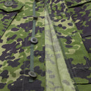 Close-up of TACGEAR Danish military style M84 camouflage field jacket with buttoned front and ripstop fabric detail.