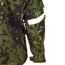 Close-up of TACGEAR Danish M84 camouflage combat shirt showing ripstop fabric and zippered arm pocket with white card inside