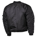 Back view of black U.S. Army MA1 style bomber jacket with ribbed cuffs, waistband, and windproof design