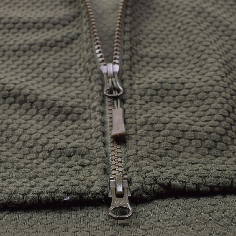 Close-up of olive green fleece fabric and durable double zipper on military style thermal jacket hooded Blochl Brand