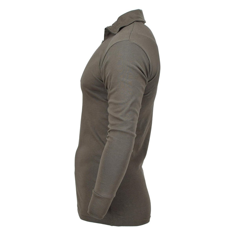 Olive green Blochl Brand military style thermal jersey shirt with high neck and 1/4 zip front shown from side view