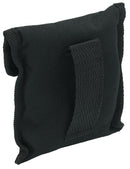 Black durable pouch with Velcro closure and loop for storing and carrying a foldable camping stove compactly.