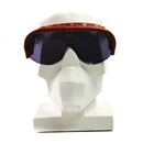 Vintage genuine Italian army tanker goggles with brown frame and blue tinted lenses on a white mannequin head