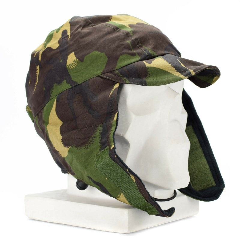 British Army DPM camouflage waterproof Gore Tex cap with ear flaps for cold weather protection on mannequin head