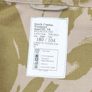 Label on British military smock jacket showing size, care instructions, and desert camouflage fabric details.