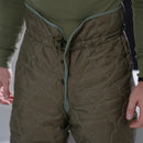 Close-up of genuine Czech army M85 thermal pants liners with quilted design and elastic waistband for winter warmth