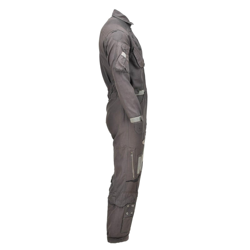 Side view of genuine Dutch Army pilot coverall jumpsuit in military surplus fabric with multiple pockets and adjustable cuffs