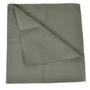 Folded green fabric on a white background