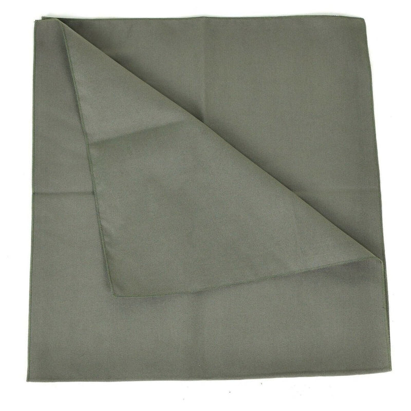 Folded green fabric on a white background