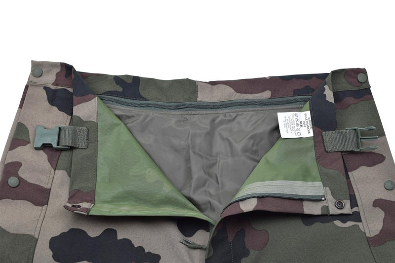 Genuine French Army waterproof trilaminate rain pants with CCE camo and adjustable braces, front zipper and button closure.