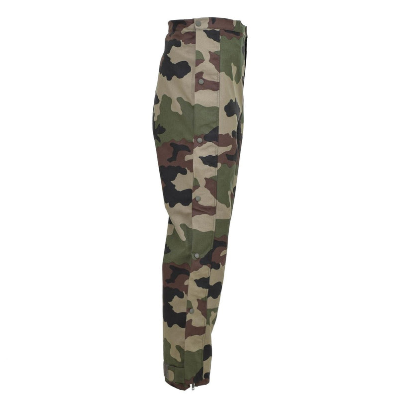 Genuine French Army waterproof trilaminate rain pants with CCE camo pattern and adjustable braces side view