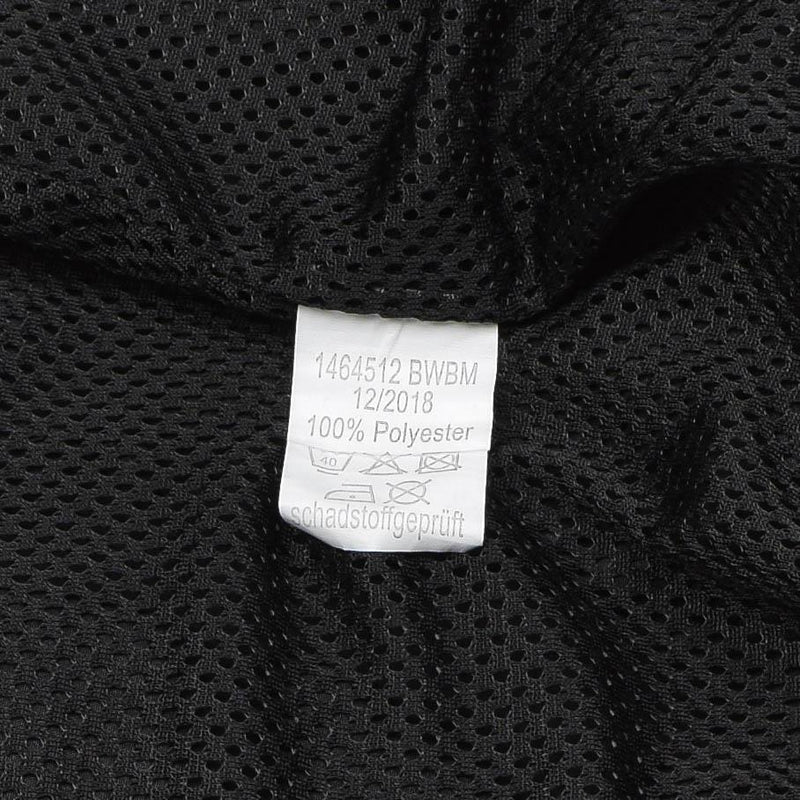 Close-up of breathable black mesh lining with care label on genuine German Bundeswehr sports jacket.