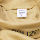 Close-up of sand-colored genuine German military police undershirt with WUNSCH & RUDOLPH label inside turtle neck collar.