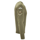 Side view of a British Army wool sweater in olive green with military patches and reinforced shoulder.