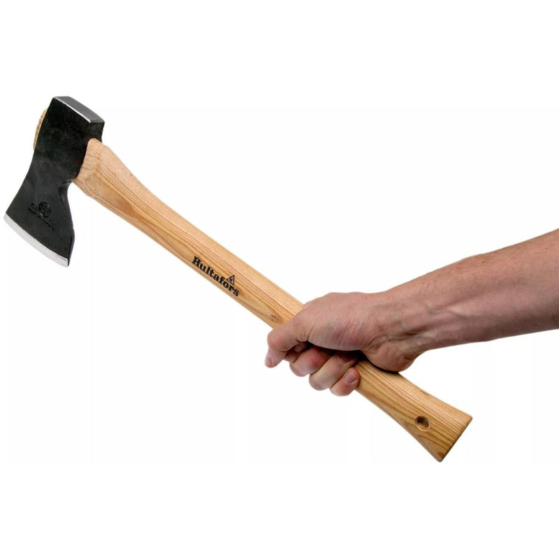 Hand holding HULTAFORS Stalberg carpenter axe with carbon steel head and wooden handle on white background