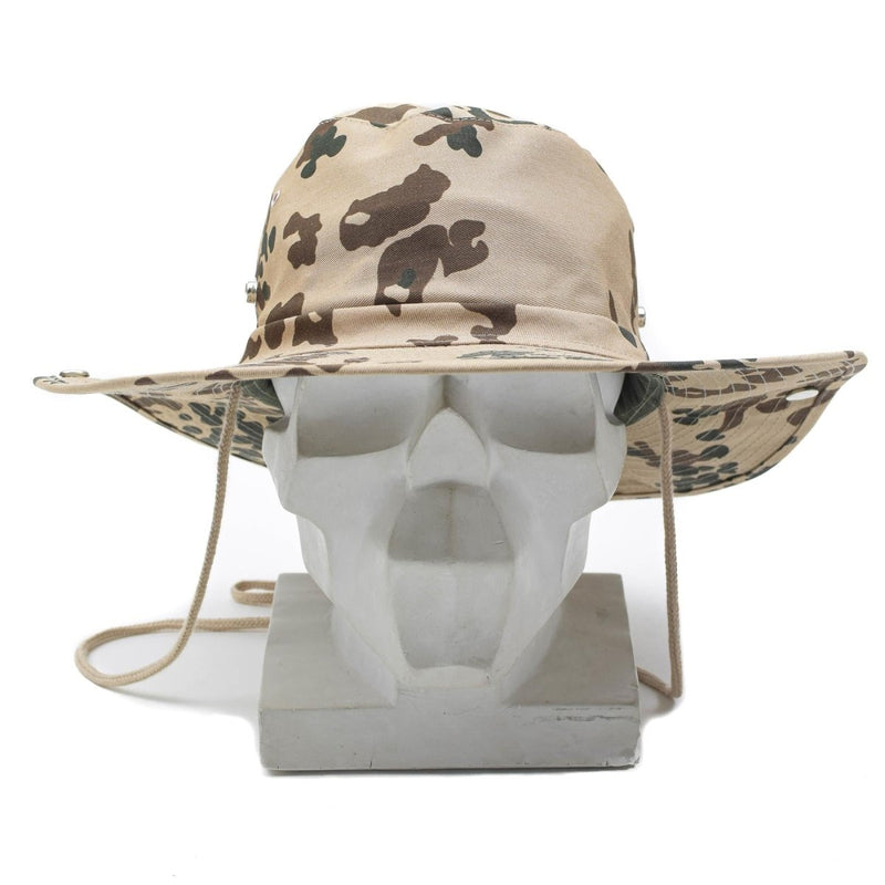 MFH military-style panama hat in tropentarn camouflage with wide brim and chin strap on white mannequin head