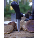 MORAKNIV fixed mushroom knife with recycled steel blade and brush standing among freshly picked mushrooms outdoors.
