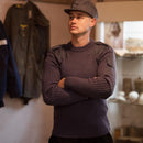 Man wearing original British Army pullover commando jumper blue grey wool sweater indoors