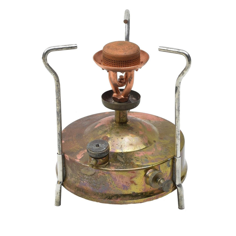 Vintage Czech military Meva camping stove liquid fuel burner with metal pot supports and brass fuel tank on white background