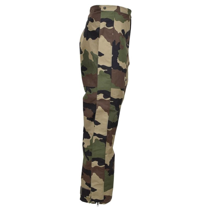Side view of original French military waterproof rain pants in CCE camo with adjustable braces and durable trilaminate material