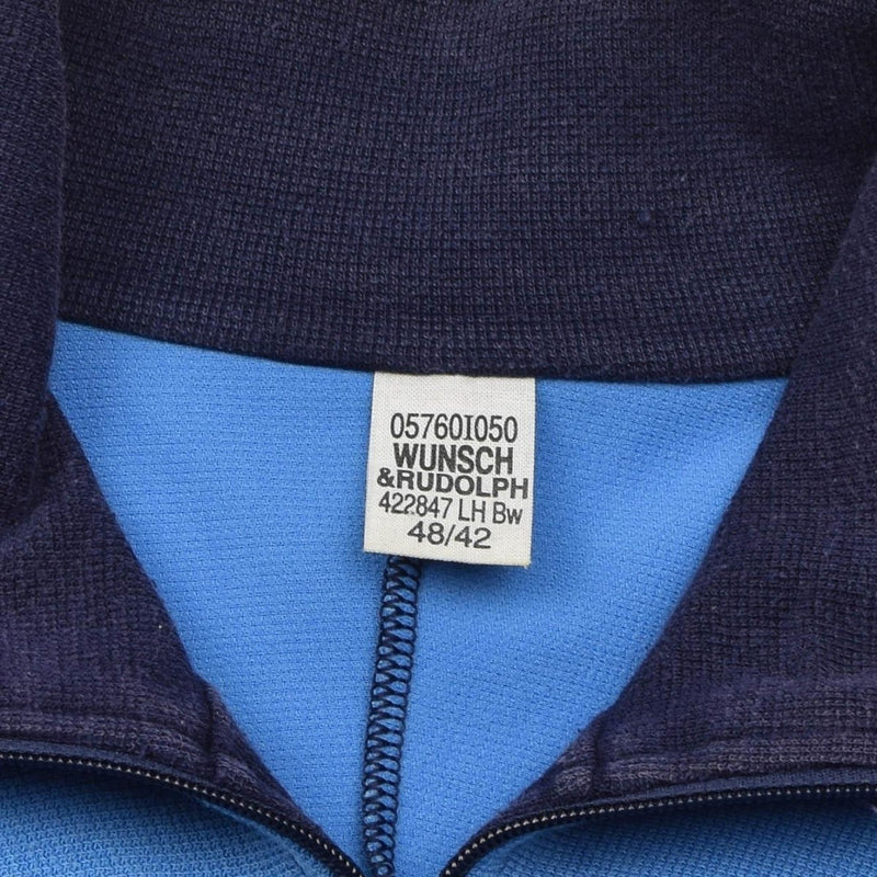Close-up of inside collar label on vintage German military sports jacket showing brand and size details