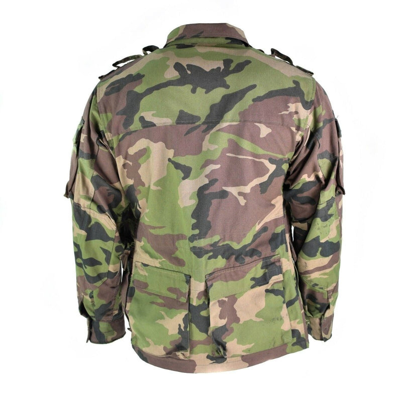 Back view of original vintage Slovakian army field jacket M97 with camouflage and multiple pockets.
