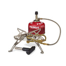 Primus Gravity III high output camping burner with foldable legs, gas canister, and ignition tool for outdoor cooking.