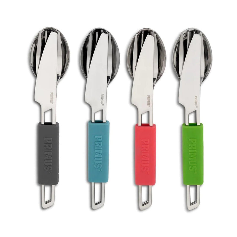 Set of four lightweight camping cutlery with knife, fork, spoon, and colorful silicone handles for outdoor use.