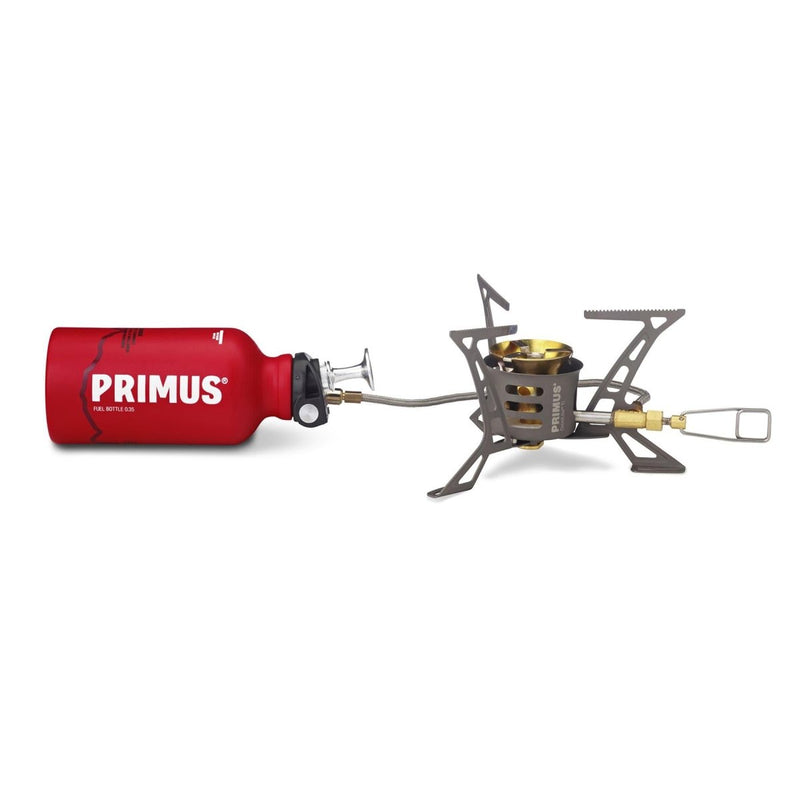 Primus OmniLite Ti lightweight titanium camping stove with multi-fuel burner and red fuel bottle isolated on white background