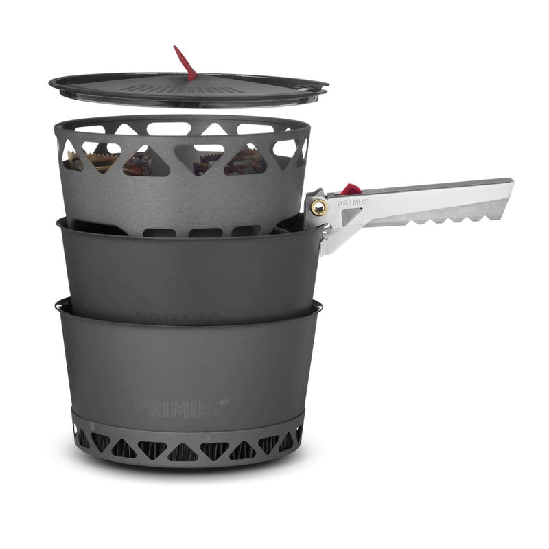 Primus PrimeTech 1.3L camping stove set with pots, burner, folding handle, and pot lid for outdoor cooking.