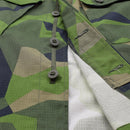 Close-up of Swedish military style commando field shirt in green and tan splinter camo with buttons and ripstop fabric